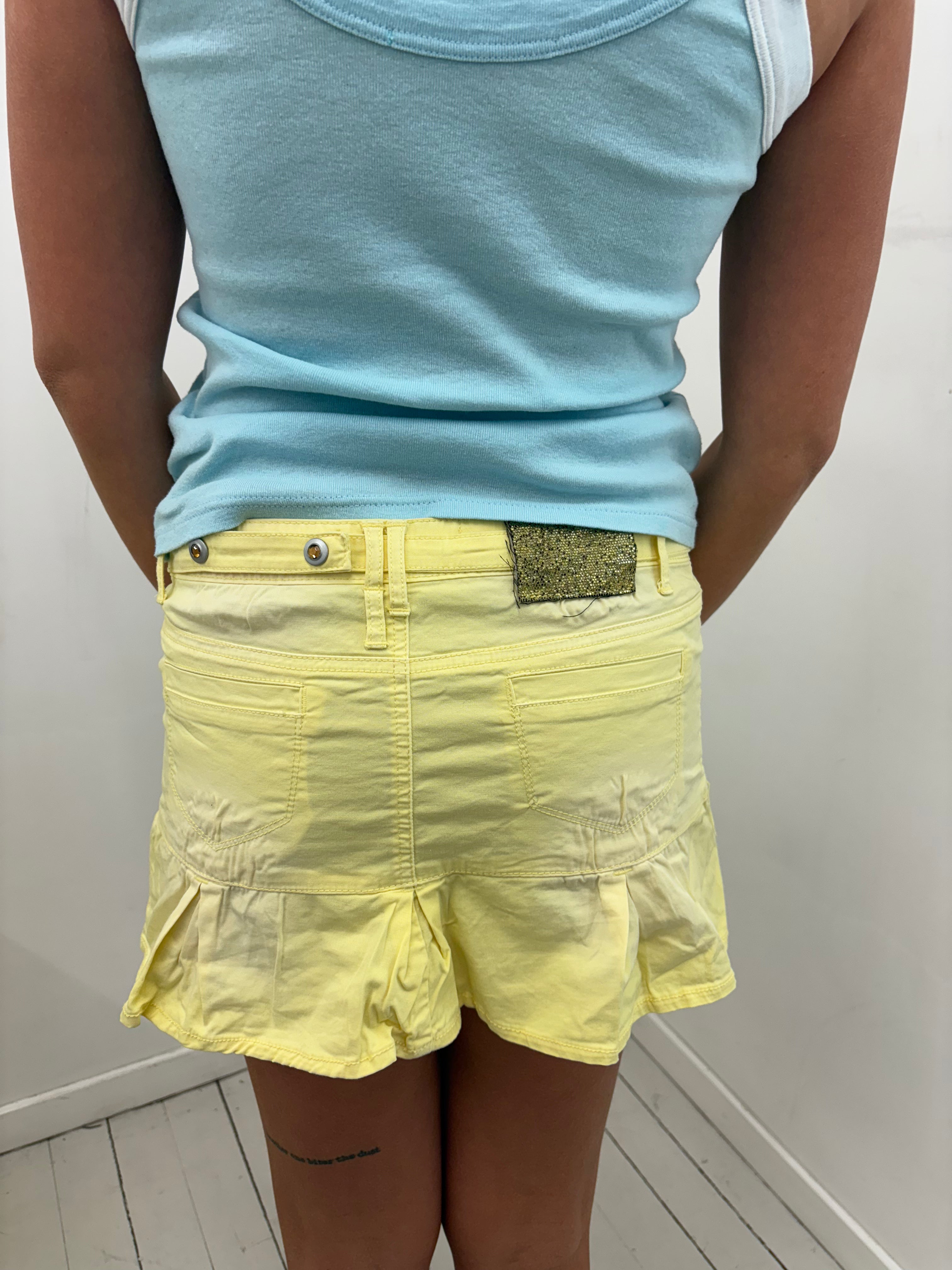 Yellow Low-Rise Mini Skirt With Studs & Pleated Hem