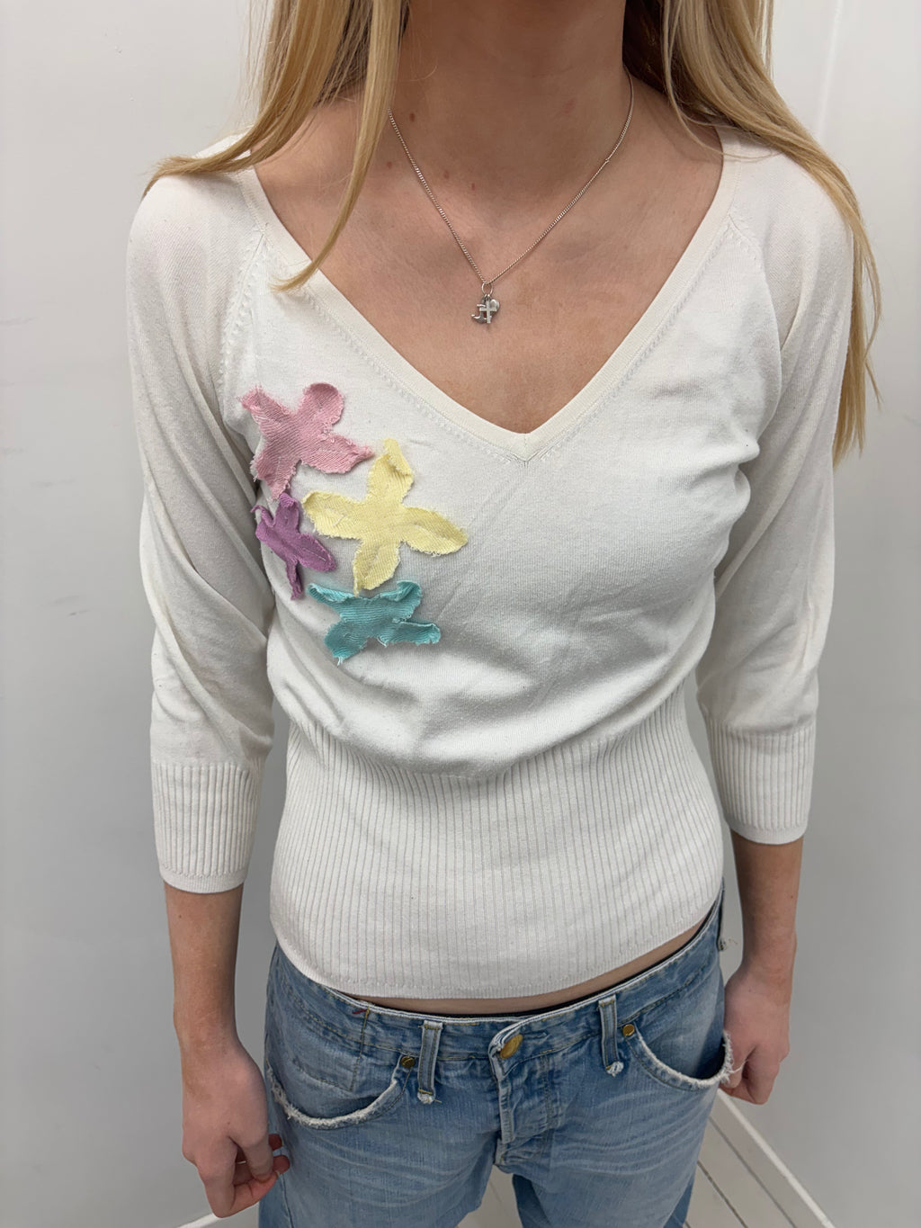 White V-Neck Sweater with Pastel Appliqué Details