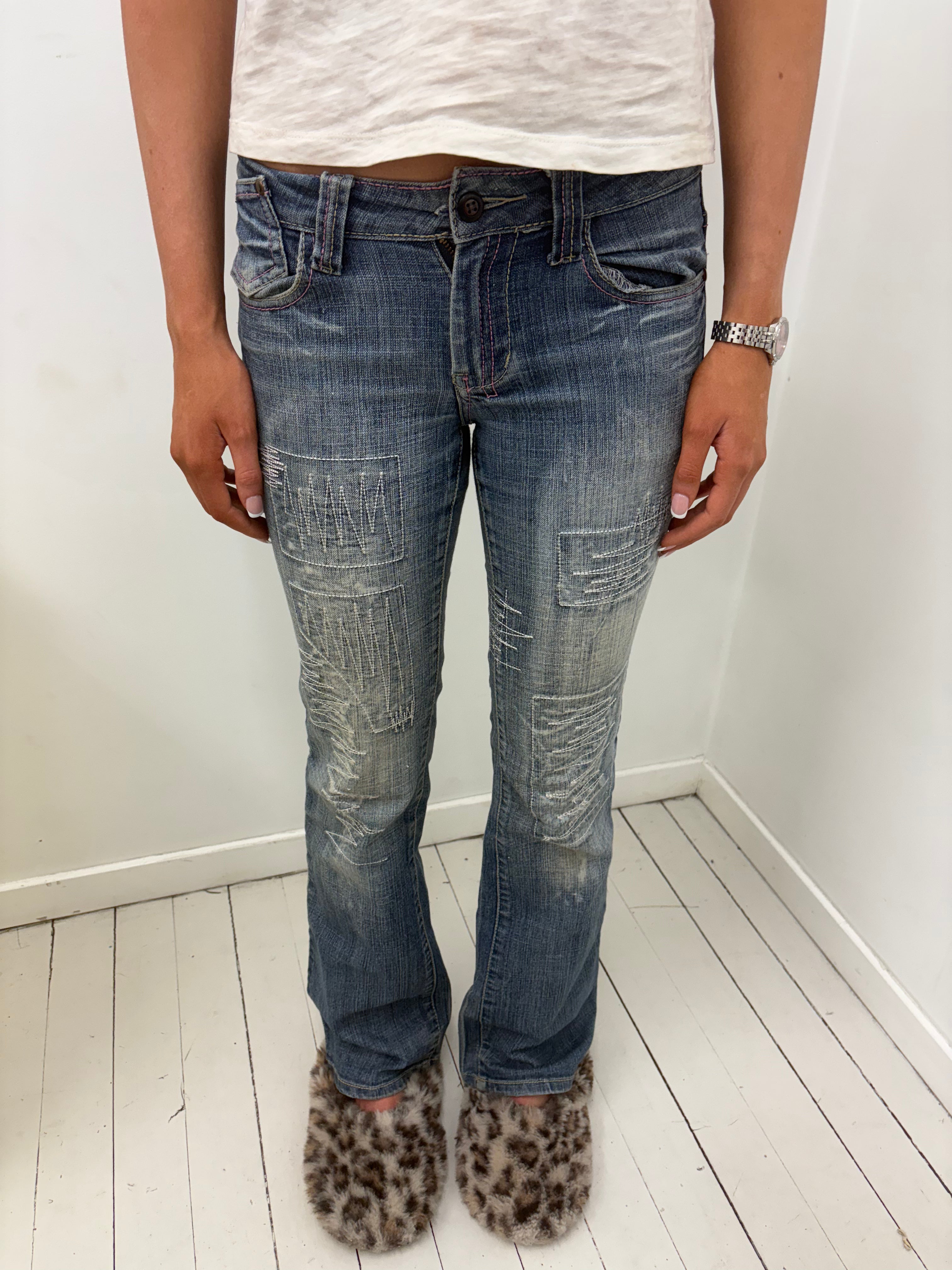 Distressed Bootcut Jeans Silver Stitch Patch Detail